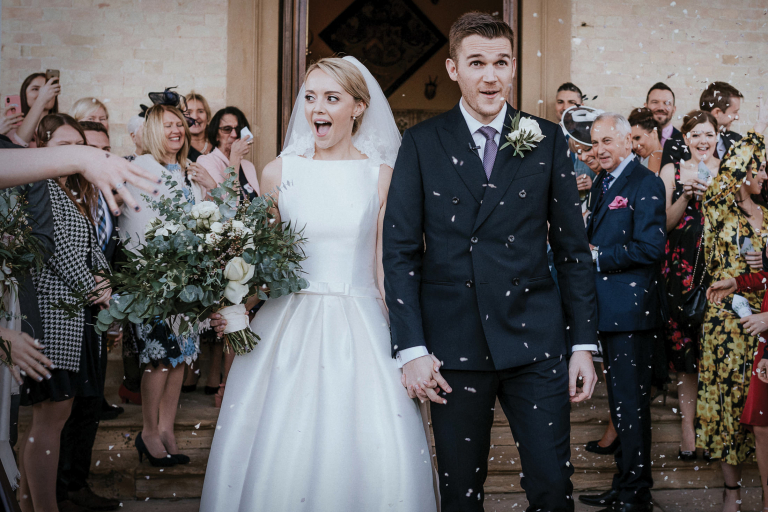 confetti falling on couple on their Stubton Hall wedding day